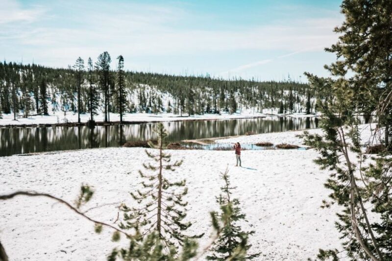 A woman standing on a snowy field